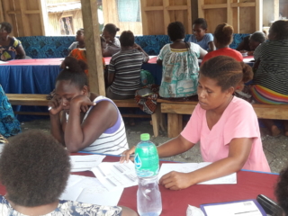 Mbahomea women attending a training on financial literacy at Tina village.